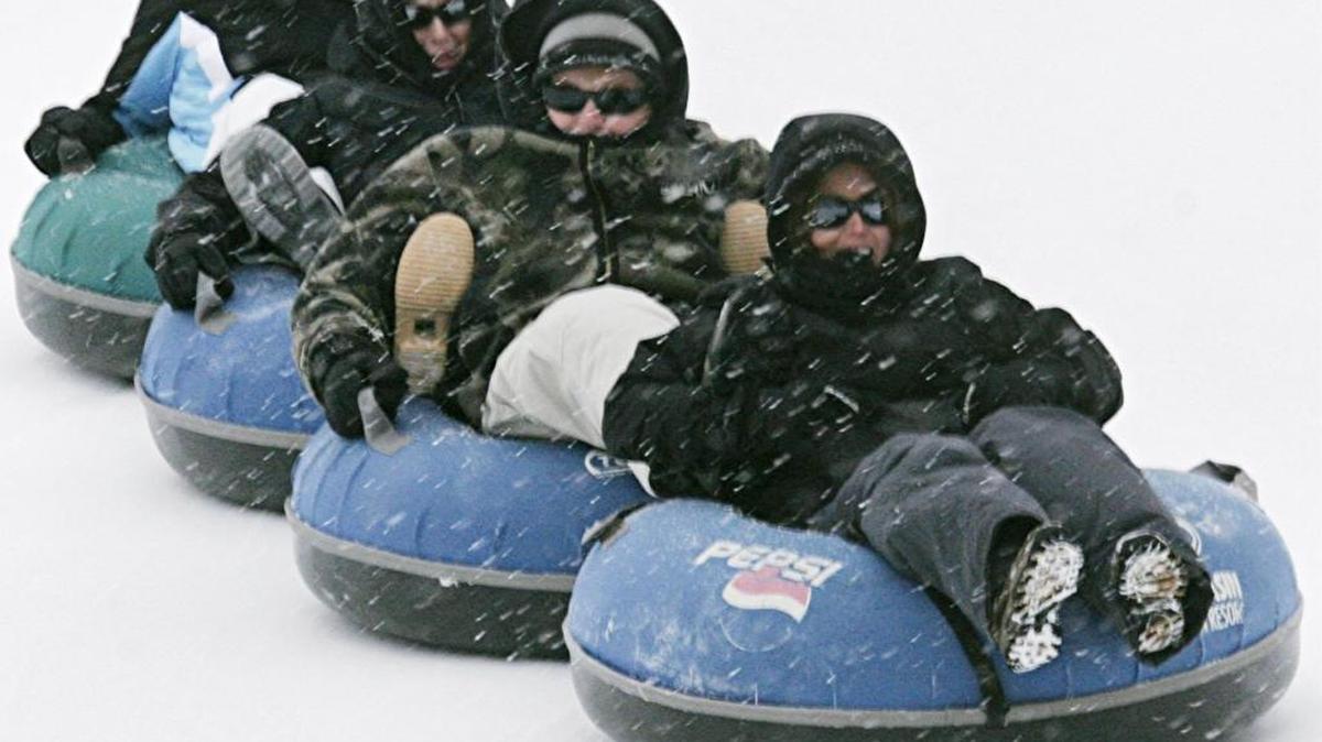 It's a tubing train. Aimee Erickson, Craig Collins, Rachel Erickson and Katie Riggs, all visitors from California, tried the Pepsi GoldRush Tubing Hill at Bogus Basin on opening day in 2008.