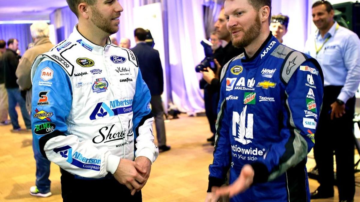 Sprint Cup drivers Brian Scott, left, and Dale Earnhardt Jr. talk during NASCAR media day last week in Florida.