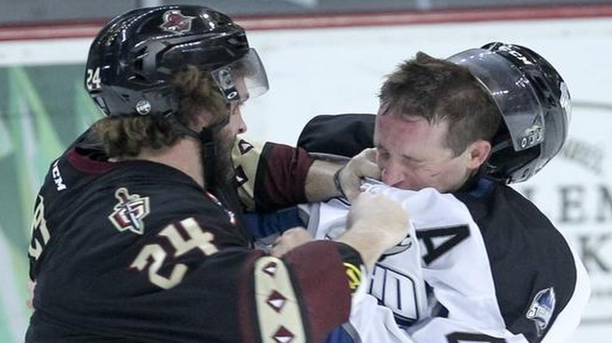 Idaho Steelheads player Andrew Carroll (43) and Atlanta Gladiators player Zach Sarig (24) exchange punches during the game at Centurylink Arena in Boise, Idaho. Wednesday November 4, 2015.