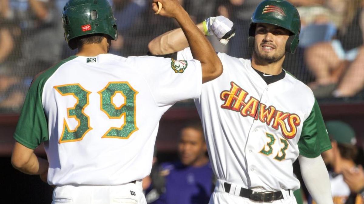 Boise Hawks first baseman Jacob Bosiokovic (39) celebrates his solo home run with teammate Willie Abreu in the first game of a doubleheader with Salem Keizer on Monday, July 11, 2016, at Memorial Stadium in Boise.
