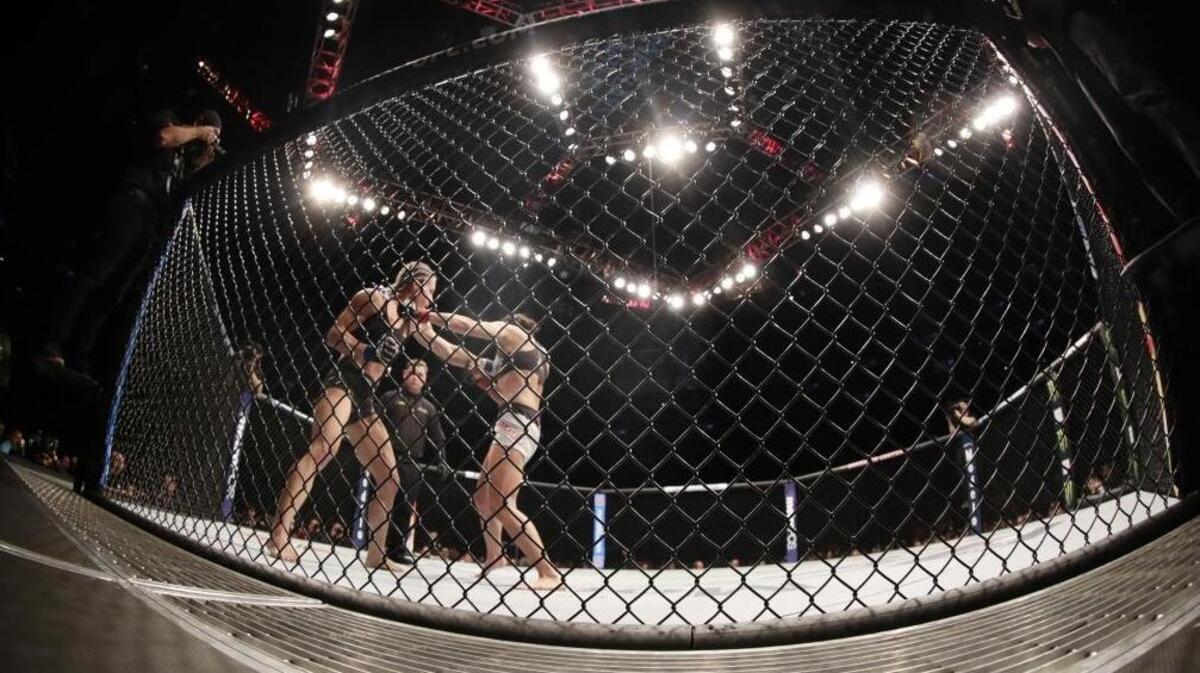 Felice Herrig, left, punches Karolina Kowalkiewicz during the third round of a women’s strawweight mixed martial arts bout at UFC 223 on April 7 in New York. The UFC is coming to Boise’s CenturyLink Arena this summer.