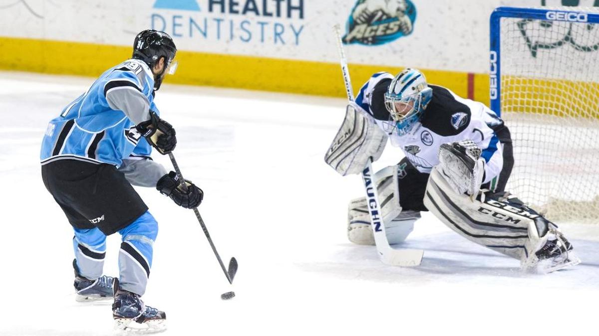 Steelheads goalie Branden Komm tries to stop a shot during Wednesday’s game at Alaska. Komm finished with 35 saves.