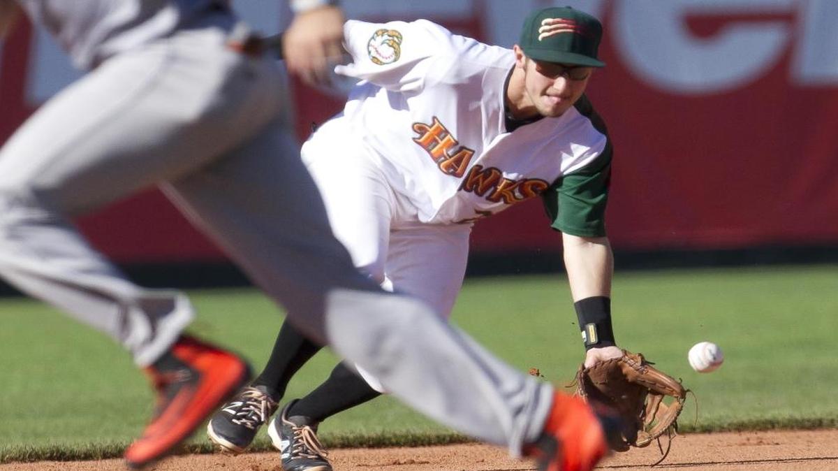 Boise shortstop Garrett Hampson scoops up a ground ball against Salem-Keizer on July 11 at Memorial Stadium in Boise.