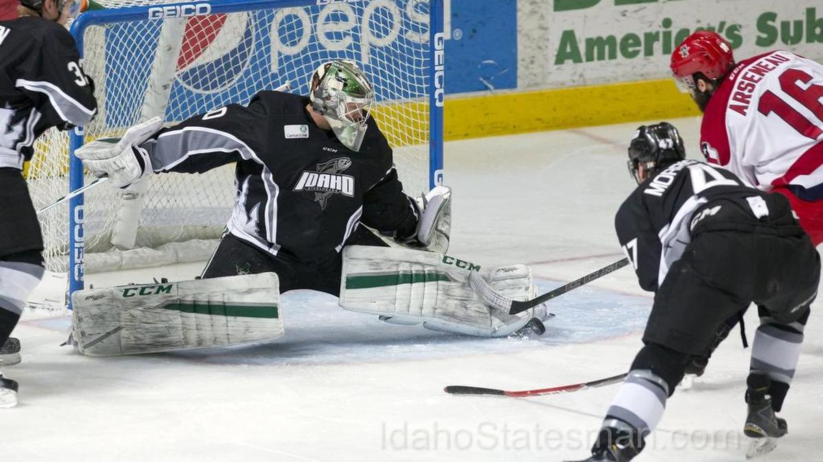 Idaho Steelheads goalie Philippe Desroslers stops the puck on a rebound shot by Allen American left wing Vincent Arseneau in Game 4 of the ECHL Western Conference quarterfinals April 22, 2016, at CenturyLink Arena in Boise.