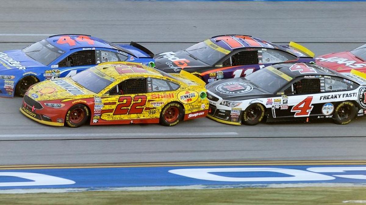 Brian Scott (44) and Joey Logano (22) lead a restart at the NASCAR Sprint Cup Hellmann’s 500 in Talladega, Ala. Scott, a Boise High graduate, finished second to Logano.