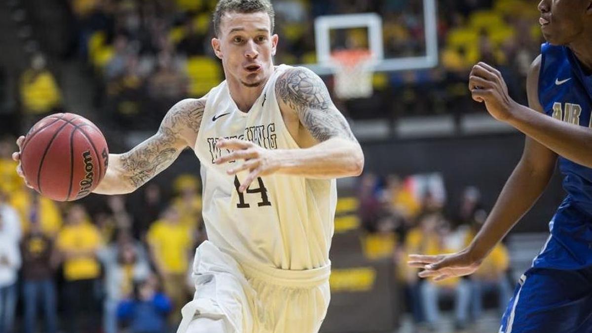 Wyoming senior guard Josh Adams, driving here against Air Force earlier this season, has been suspended for Saturday’s game against Boise State.