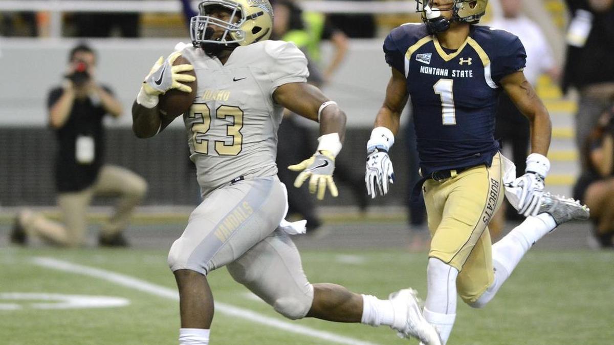 Idaho running back Aaron Duckworth breaks away from Montana State’s Tre’von Strong for a touchdown during their season opener at the Kibbie Dome in Moscow.