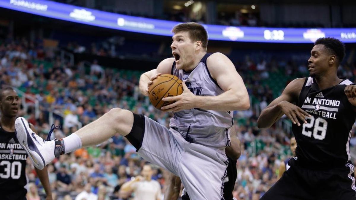 Idaho Stampede forward Jack Cooley pulls down a rebound during a summer league game with the Utah Jazz.