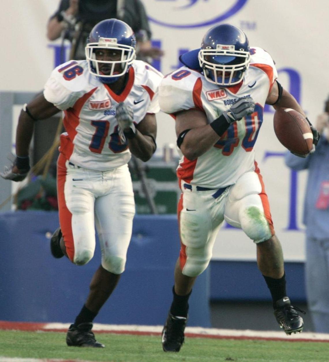 Boise State linebacker Andy Avalos runs back an interception for a touchdown against Louisville during the first quarter of the Liberty Bowl on Dec. 31, 2004, in Memphis, Tenn. Blocking for Avalos is Gabe Franklin. Avalos is Boise State’s defensive coordinator; Franklin is the safeties coach.