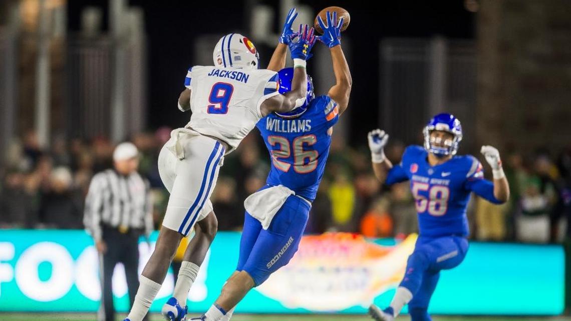 Boise State cornerback Avery Williams picks off a pass intended for Colorado State receiver Warren Jackson last week in Fort Collins, Colo.