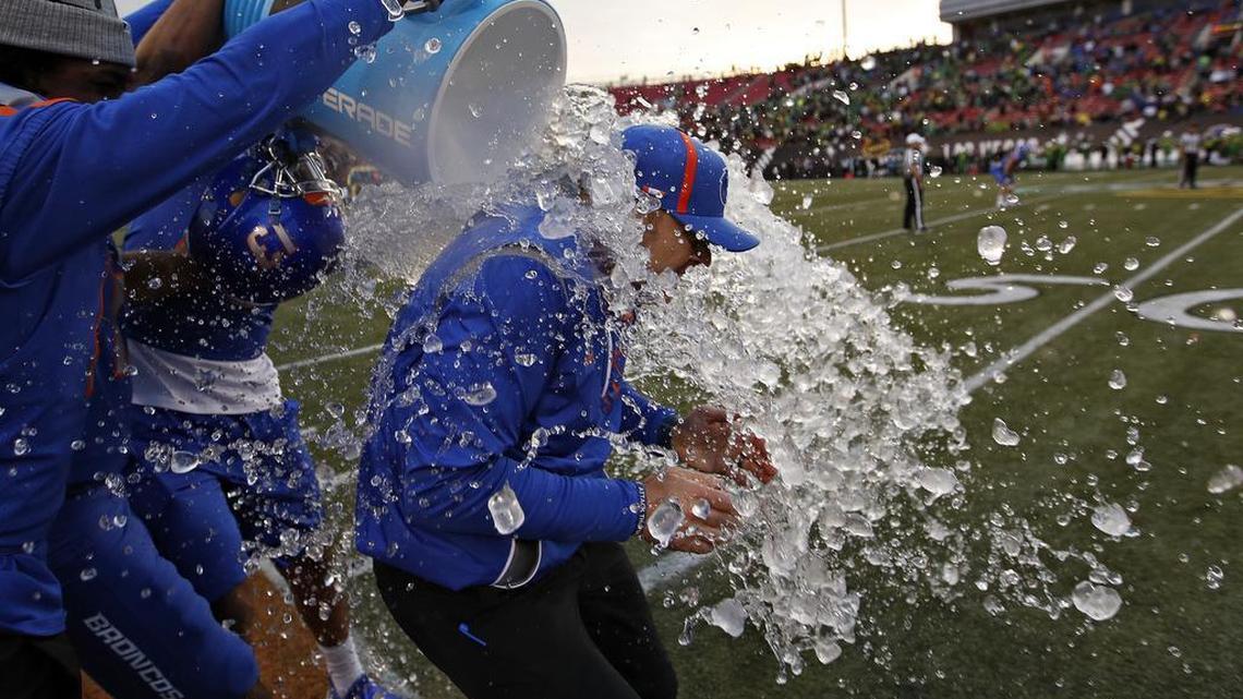 Boise State coach Bryan Harsin is doused as his team leads Oregon with seconds left in the Las Vegas Bowl.