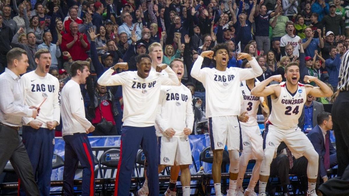 Gonzaga’s bench and fans go wild after a basket and foul in the Bulldogs’ 90-84 second-round win against Ohio State on Saturday in Boise.