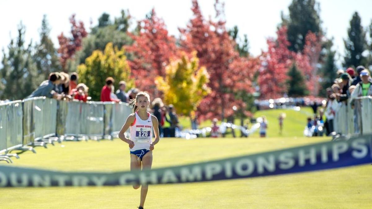 Allie Ostrander crosses the finish line to win the Mountain West women’s championship Friday at Montreux Golf Club in Reno.