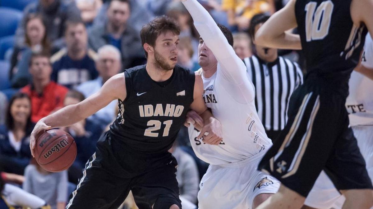 Marcus Colbert scored 21 of his 23 points in the second half to rally Montana State to a 70-68 victory over Idaho on Saturday. Colbert made 1-of-2 free throws with 7 seconds left for a 69-66 lead. A jump ball followed the miss, and the ball stayed with the Bobcats (9-11, 4-4 Big Sky). Tyler Hall, who had 16 points, added a clinching free throw. Idaho (12-8, 4-3) played without its top two scorers, injured guards Perrion Callendret and Victor Sanders. Ty Egbert led the Vandals with a career-high 18 points, 15 in the second half. Above: Idaho forward Arkadiy Mkrtychyan drives through the MSU defense.