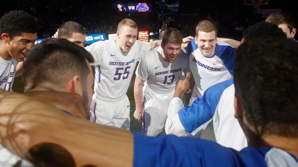 Boise State seniors James Reid (55) and Nick Duncan (13) in the team huddle before an NCAA college basketball game against Fresno State in Boise, Idaho, Tuesday, Feb. 28, 2017.