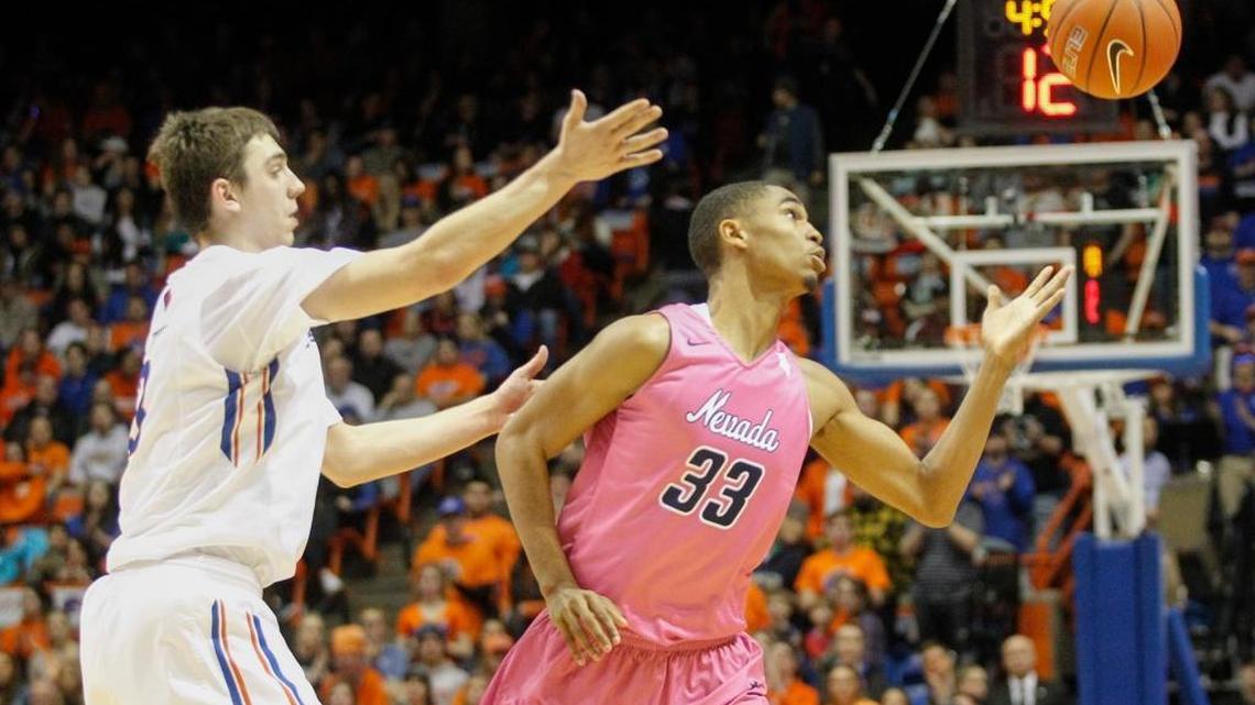 Boise State’s Justinian Jessup and Nevada’s Josh Hall reach for a loose ball during their Mountain West basketball game in Boise on Wednesday, Jan. 25, 2017. Nevada won 76-57.