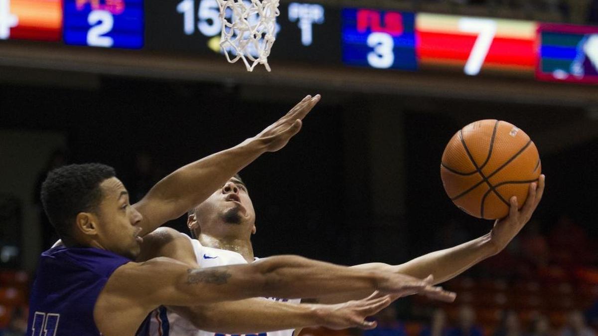 Boise State guard Alex Hobbs drives the lane on College of Idaho guard Talon Pinckney during an exhibition game Nov. 2 at Taco Bell Arena in Boise.