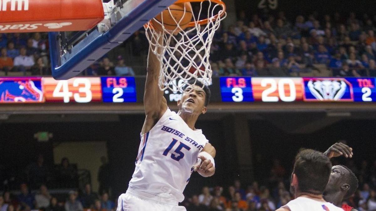 Boise State guard Chandler Hutchison dunks on a putback against New Mexico on Wednesday at Taco Bell Arena in Boise.