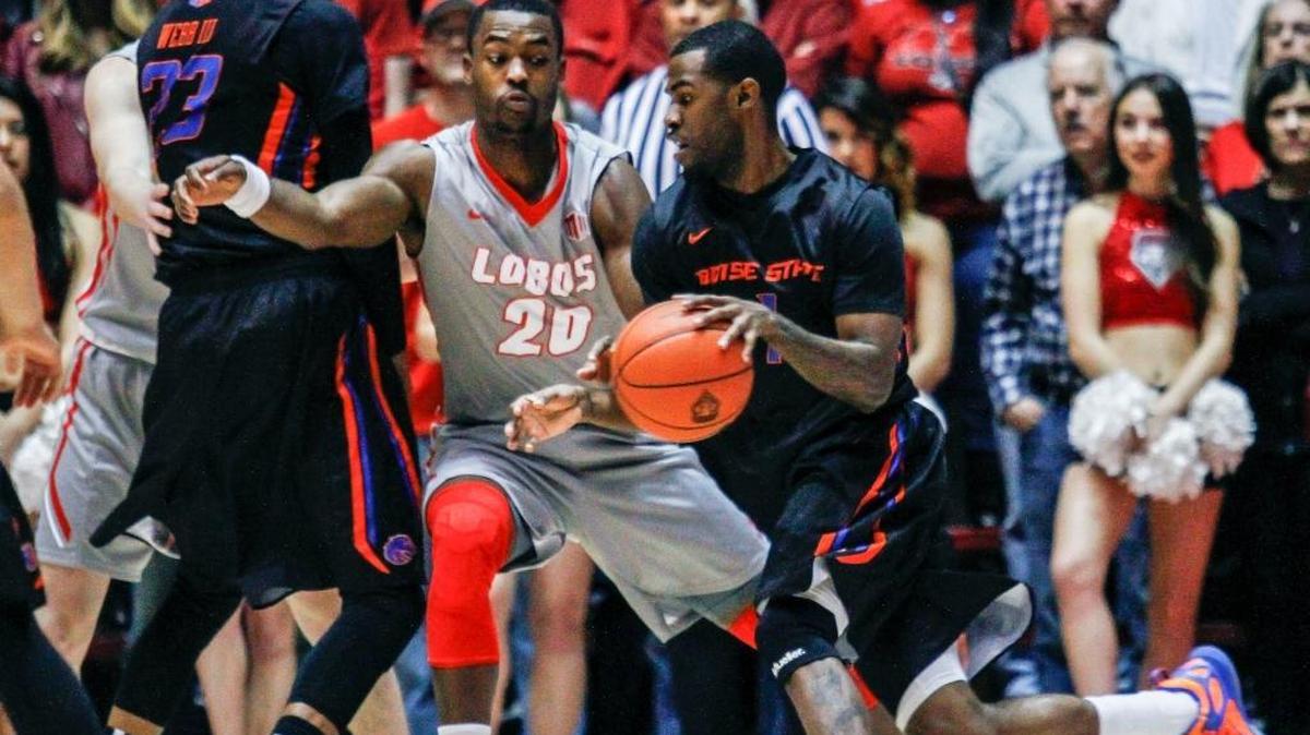 Boise State’s Mikey Thompson (1) dribbles around New Mexico’s Sam Logwood (20) during the first half Wednesday in Albuquerque, N.M.