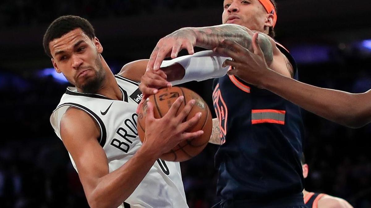 Brooklyn Nets forward James Webb III (0) pulls down a rebound against New York Knicks forward Michael Beasley (8) during the third quarter Jan. 30 in New York.