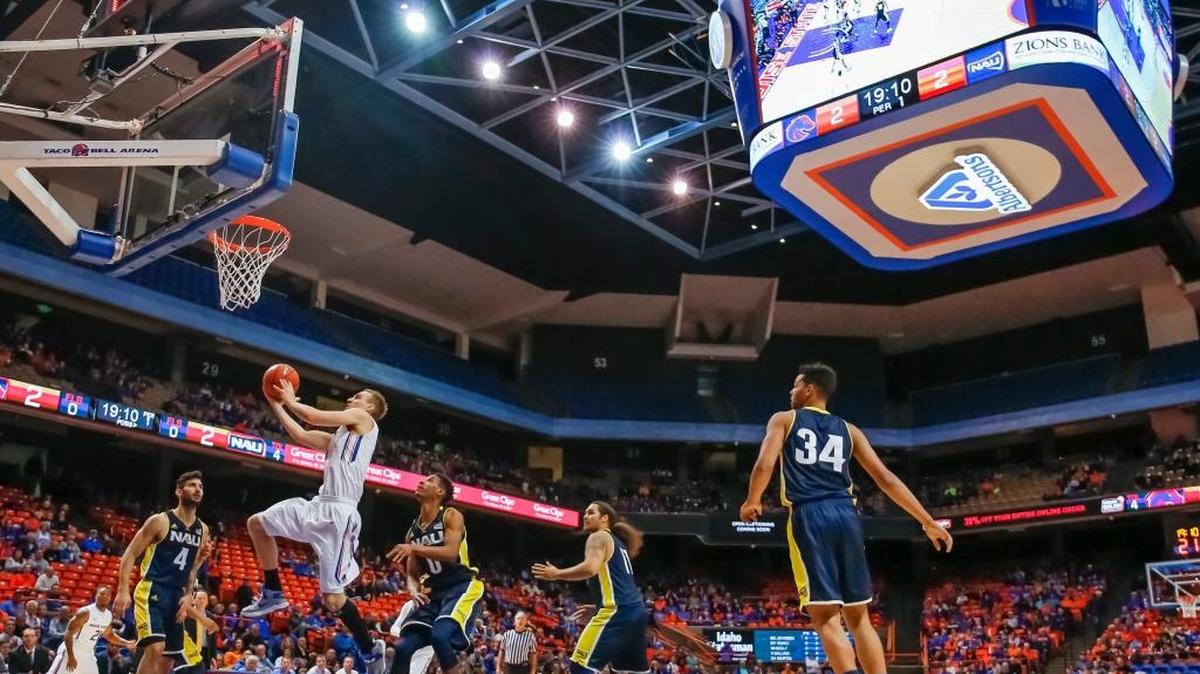 Boise State’s Anthony Drmic goes up to the basket during the first half of their college basketball game against Northern Arizona on Monday. The videboard is a new addition to Taco Bell Arena this season.