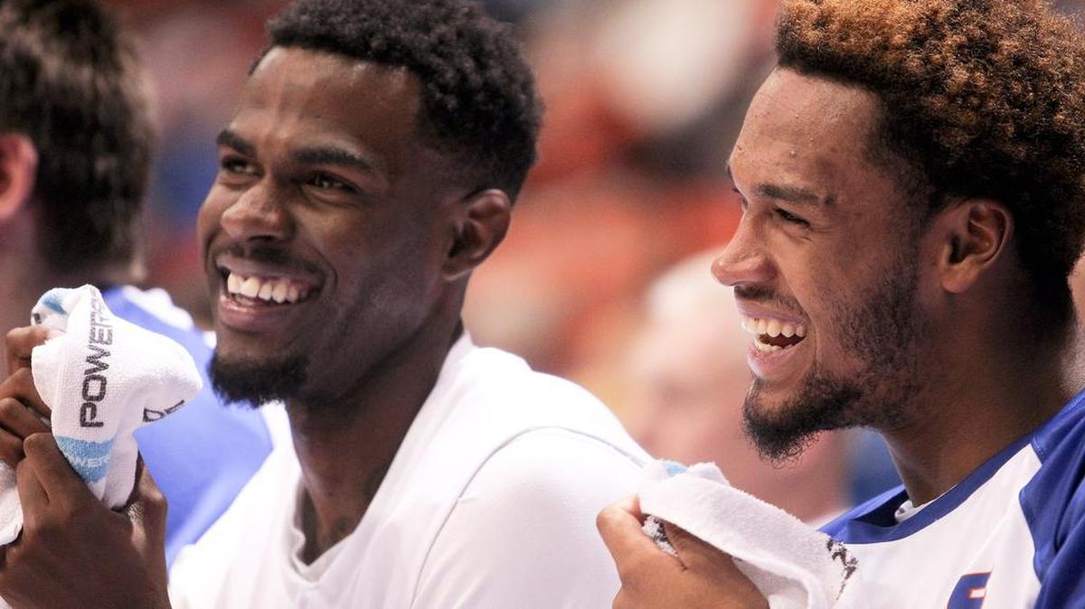 Boise State Broncos guard Mikey Thompson (left) and forward James Webb III (right) laugh on the bench during the second half against the Willamette Bearcats at Taco Bell Arena in Boise, Idaho. Wednesday December 2, 2015. Boise State defeated Willamette 100-36.