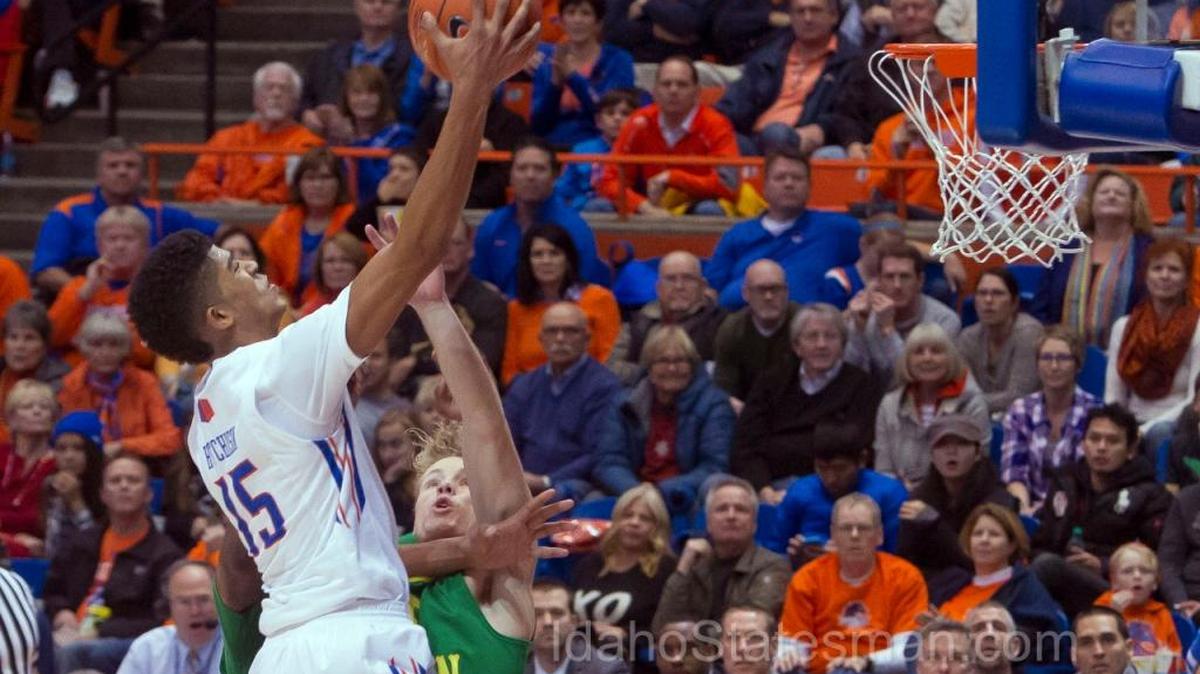 Boise State guard Chandler Hutchison rises over Oregon guard Tyler Dorsey for a shot in the paint Saturday, Dec. 12, 2015, at Taco Bell Arena in Boise.