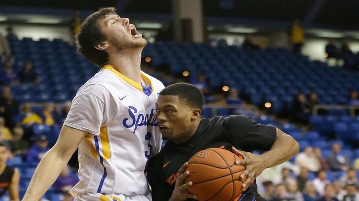 Boise State guard Montigo Alford is fouled by San Jose State forward Cody Schwartz while driving to the basket during the first half of their basketball game in San Jose, Calif., on Saturday, March 5, 2016.