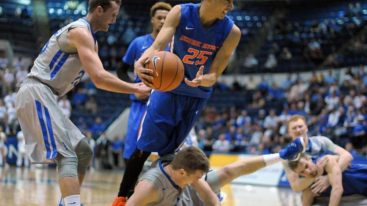 Boise State guard Lonnie Jackson gets tied up under the basket during Saturday’s game against Air Force at Clune Arena in Colorado Springs, Colo.
