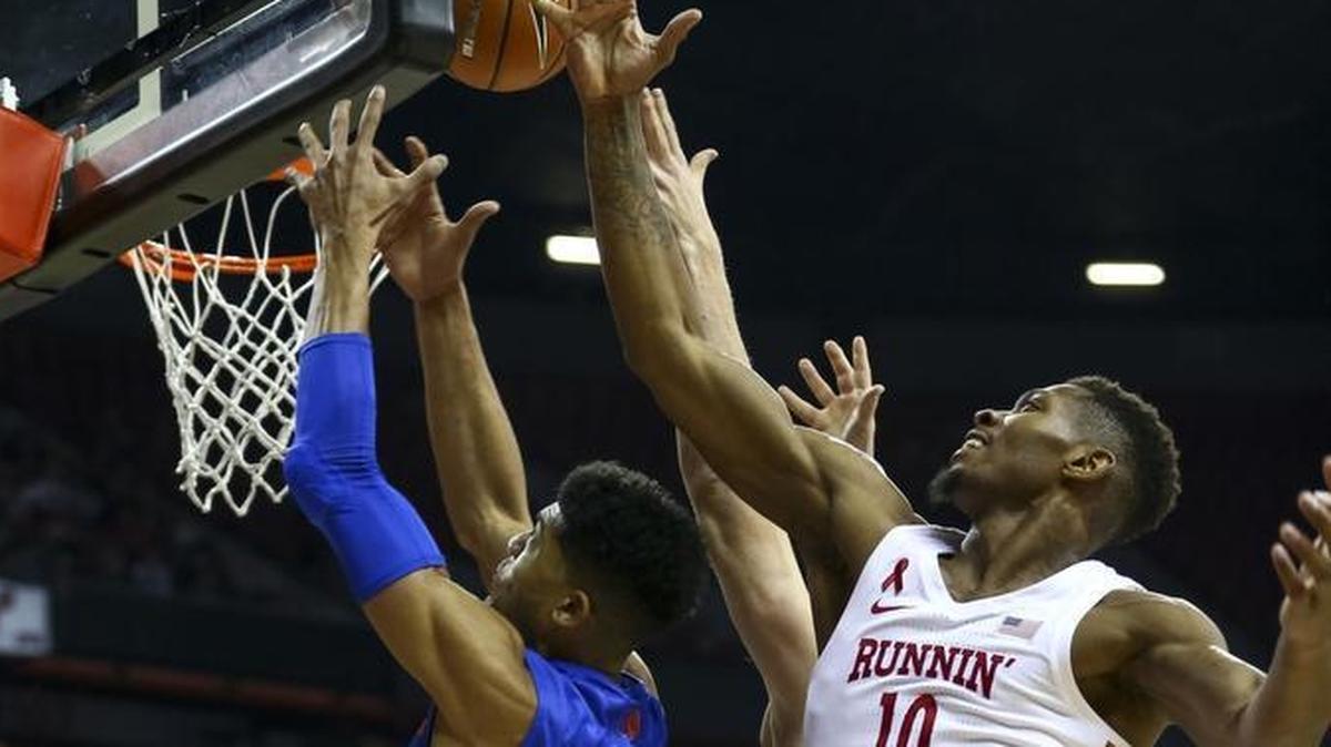 UNLV forward Shakur Juiston and Boise State’s Chandler Hutchison vie for a rebound during their game Dec. 30 in Las Vegas. The Broncos outrebounded the Rebels 48-29 in their 83-74 victory.