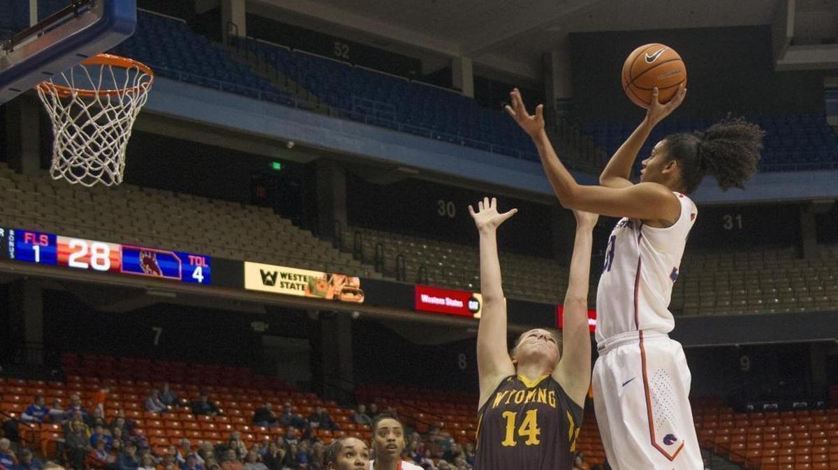 Boise State forward Joyce Harrell shoots a jumper over Wyoming forward Natalie Baker on Saturday at Taco Bell Arena in Boise. The Broncos lost 66-51.