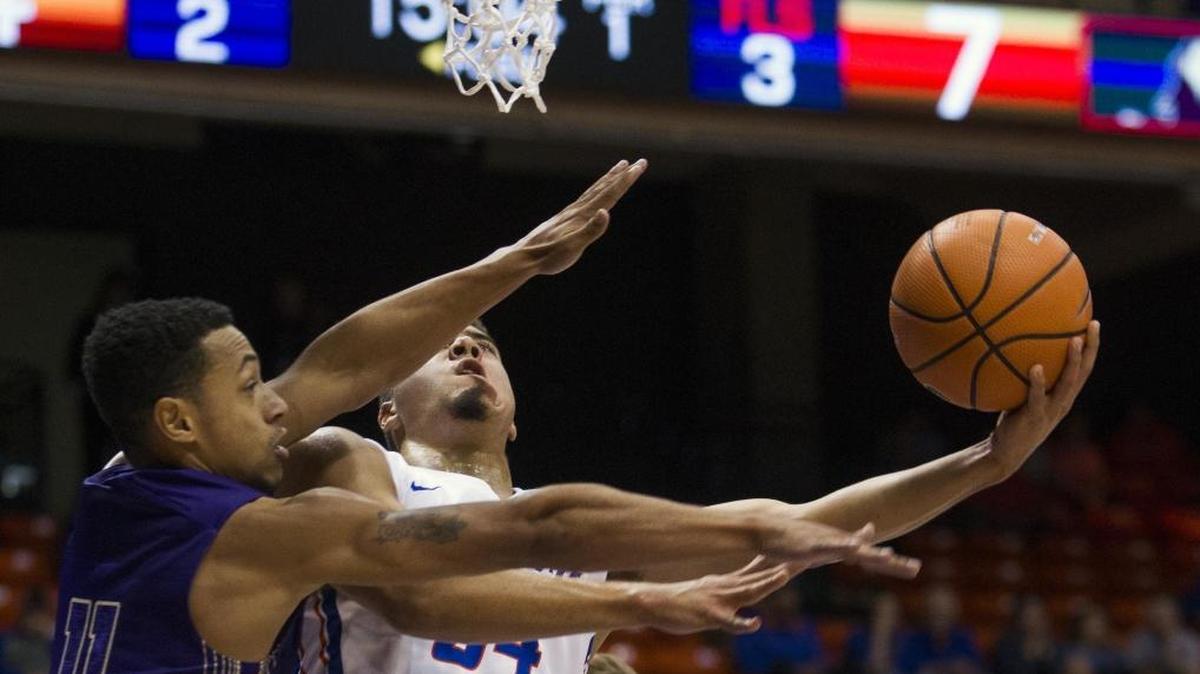 Boise State guard Alex Hobbs drives the lane on College of Idaho guard Talon Pinckney during an exhibition game Nov. 2, 2017, at Taco Bell Arena in Boise.