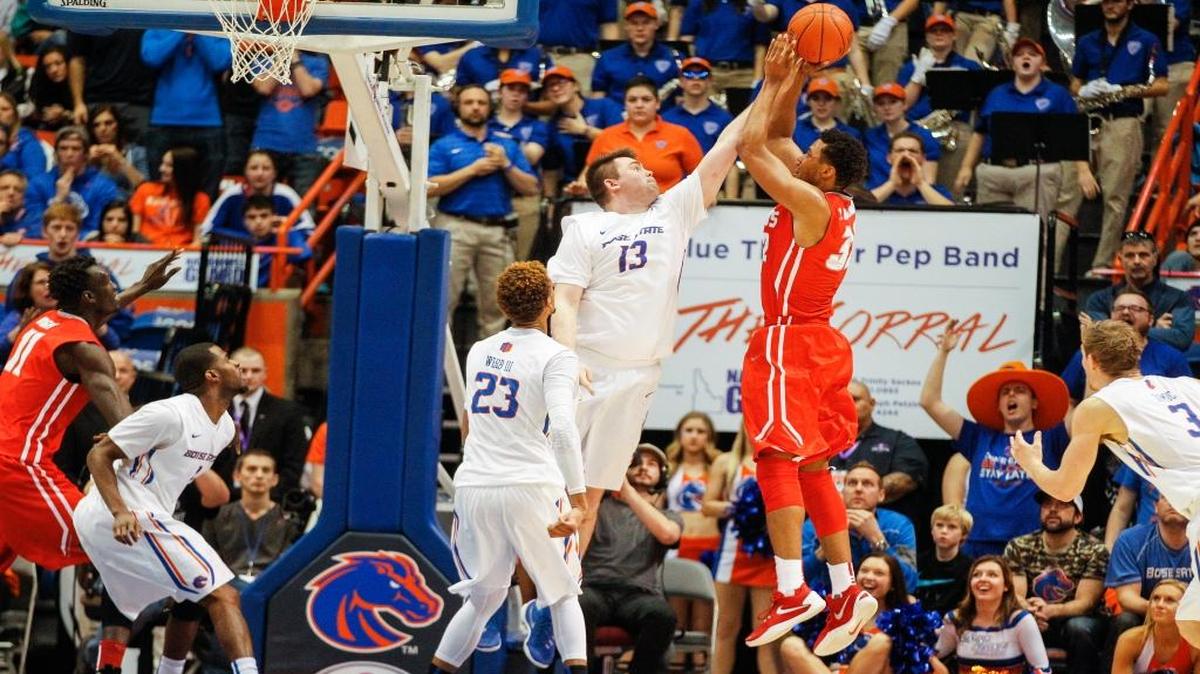 New Mexico’s Tim Williams shoots over Boise State’s Nick Duncan during the second half of their basketball game in Boise on Saturday, Jan. 30, 2016. New Mexico won 88-83.