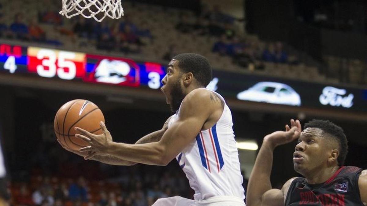 Boise State guard Lexus Williams takes the ball to the hoop against Southern Utah’s Christian Musoko at Taco Bell Arena.