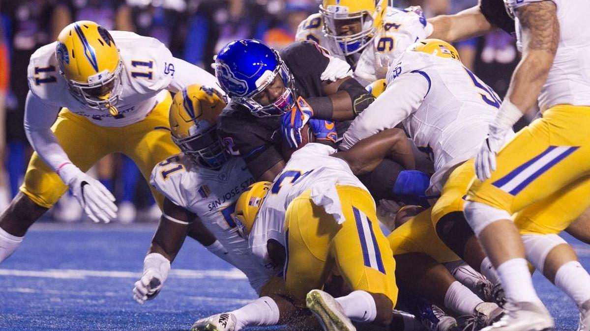 Boise State running back Alexander Mattison (22) is tackled by the San Jose State defense during the first half of the game at Albertsons Stadium in Boise, Idaho. Friday November, 04, 2016.
