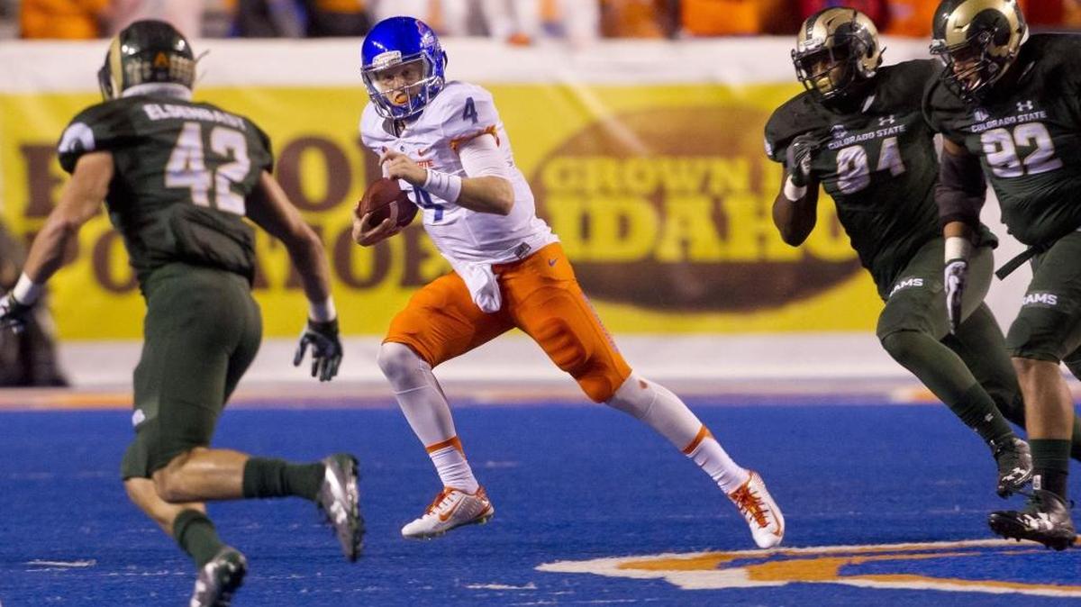 Boise State quarterback Brett Rypien keeps the ball and runs against the Colorado State defense Oct. 15, 2016, at Albertsons Stadium in Boise. The Broncos won 28-23.