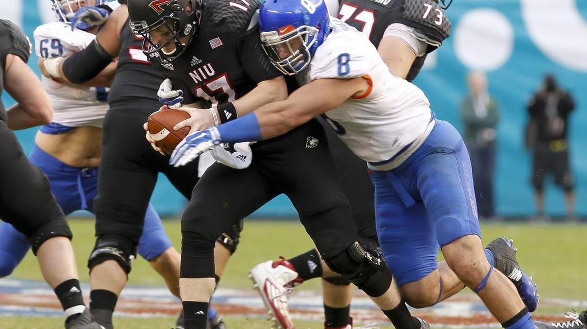Boise State defensive end Kamalei Correa sacks Northern Illinois quarterback Ryan Graham during the Poinsettia Bowl on Dec. 23 at Qualcomm Stadium in San Diego.