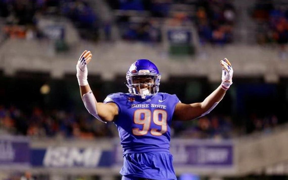 Boise State STUD end Curtis Weaver gets the crowd going during the Mountain West football championship against Fresno State on Dec. 2, 2017 at Albertsons Stadium in Boise.