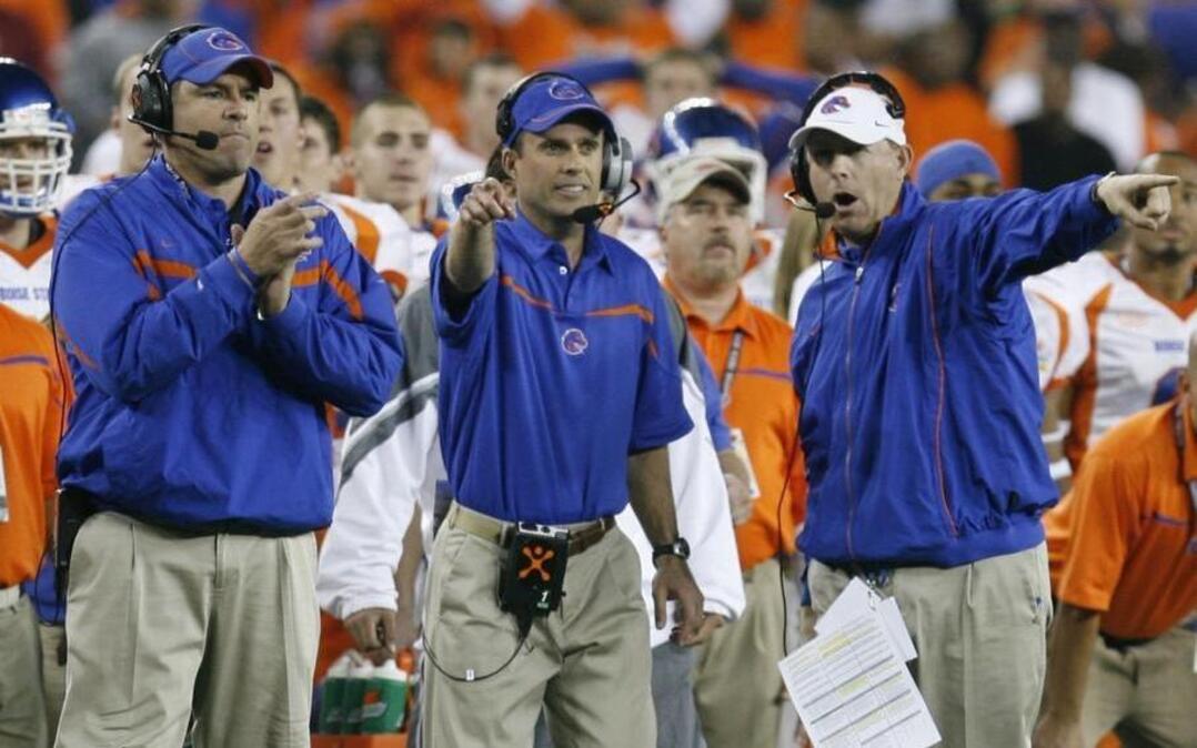 Defensive line coach Pete Kwiatkowski, left, head coach Chris Petersen, center, and wide receivers coach Brent Pease work the sideline during Boise State’s overtime victory over Oklahoma in the Fiesta Bowl on Monday, Jan. 1, 2007, in Glendale, Ariz.