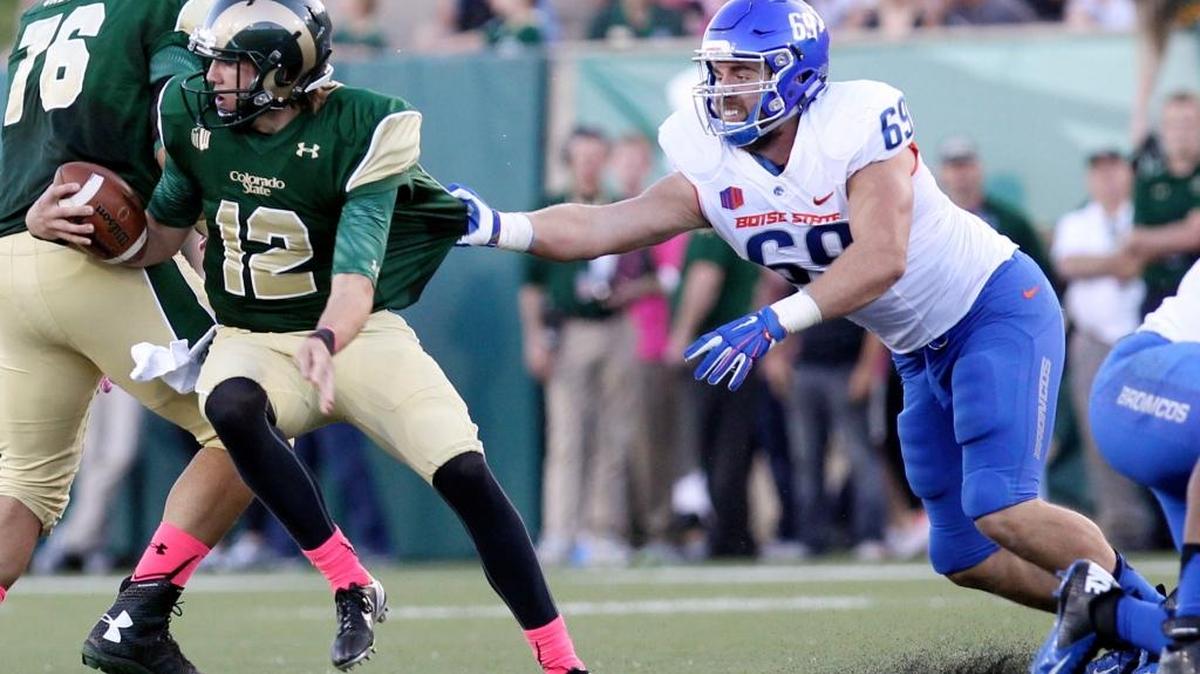 Defensive end Tyler Horn reaches out for Colorado State quarterback Coleman Key during their Oct. 10 game in Fort Collins, Colo,