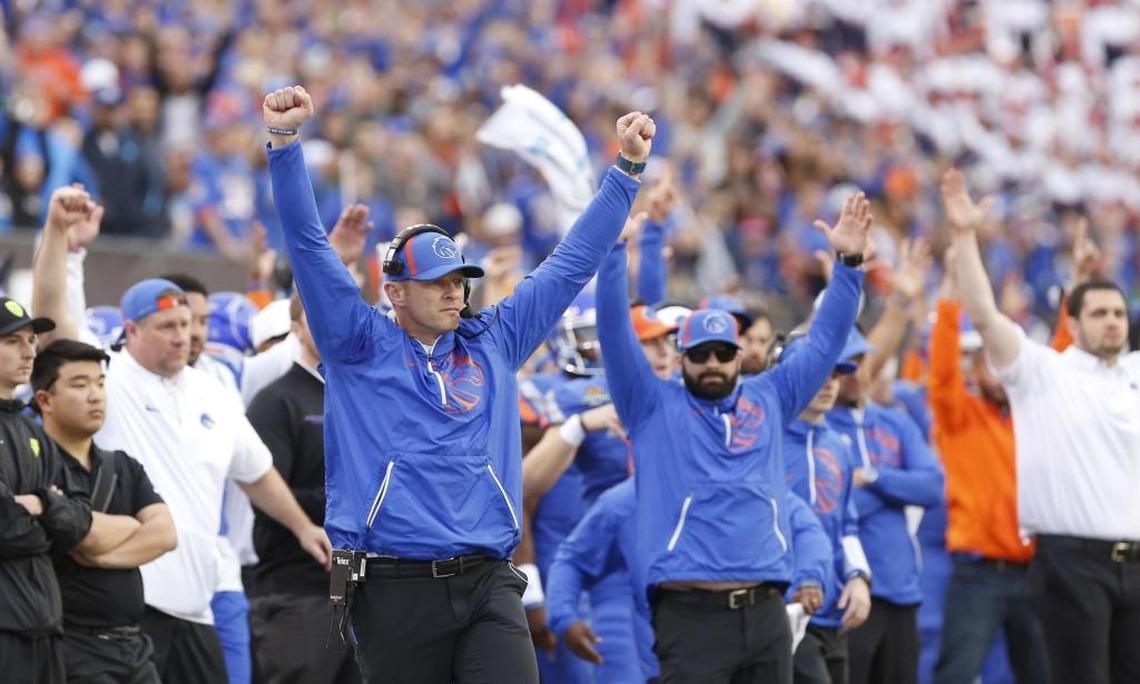 Boise State coach Bryan Harsin celebrates the final Broncos touchdown Saturday against Oregon in the Las Vegas Bowl at Sam Boyd Stadium.