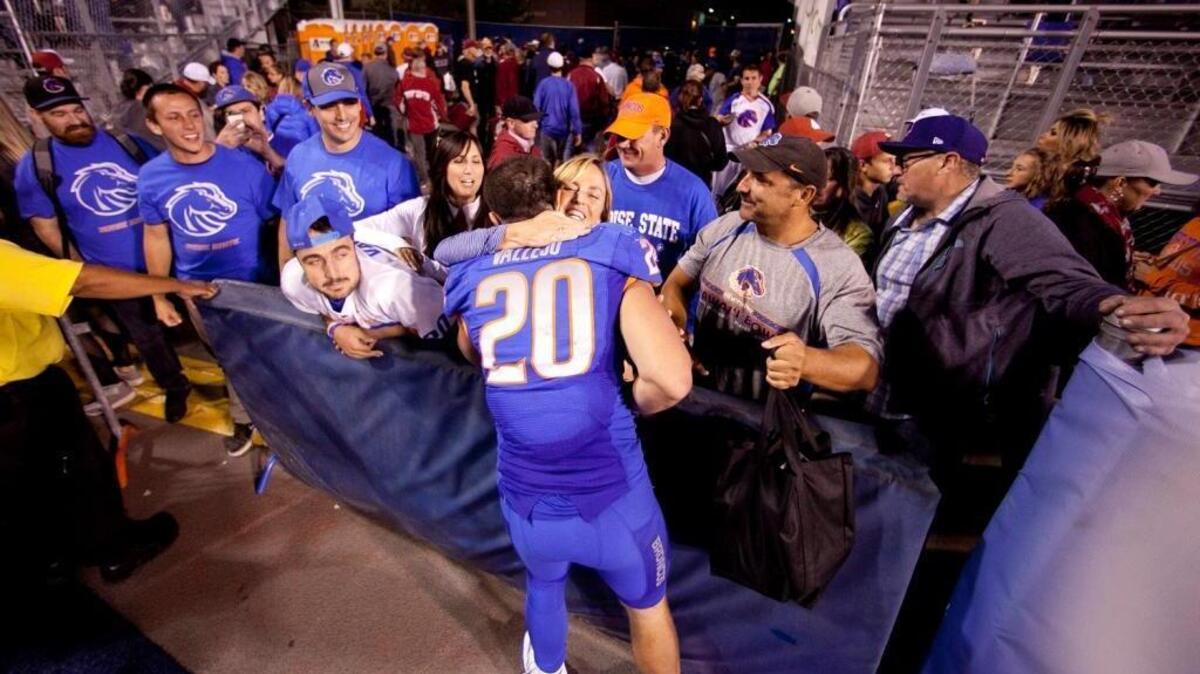 Boise State linebacker Tanner Vallejo receives a hug after the Broncos’ win over Washington State on Sept. 11. The senior injured his wrist in that game, an injury that forced him to prematurely end his college career.