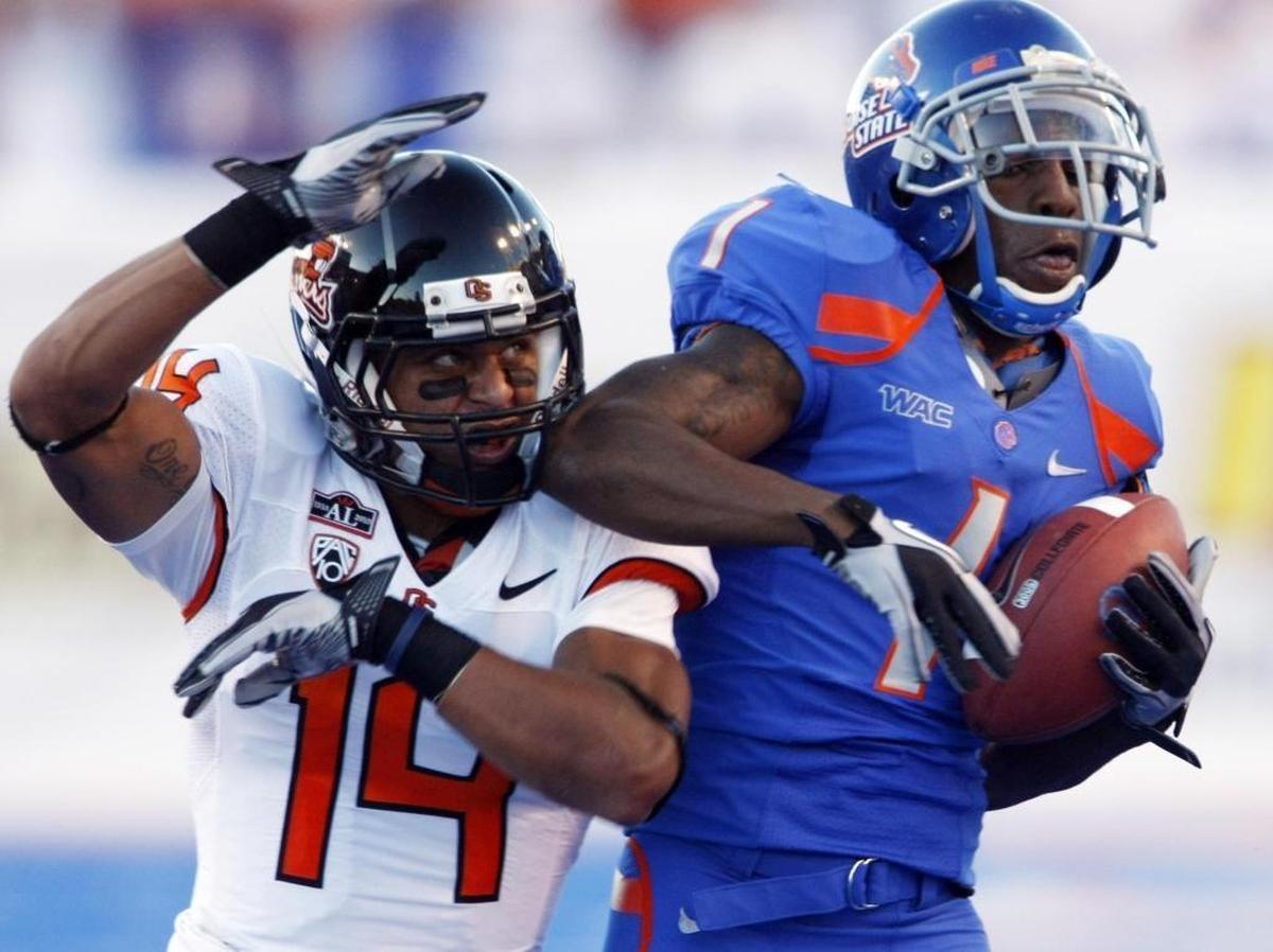 Boise State wide receiver Titus Young pulls in a long pass defended by Oregon State safety Jordan Poyer in 2010 at Bronco Stadium in Boise.