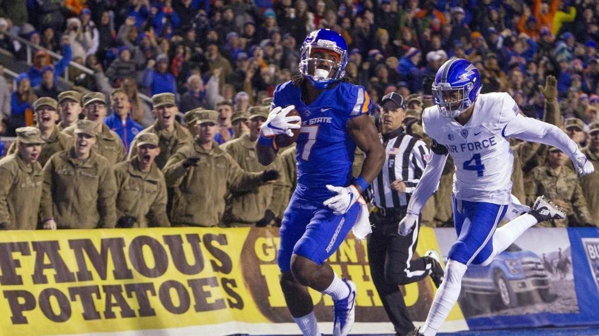 Boise State wide receiver A.J. Richardson (7) scores a touchdown on an 87-yard reception defended by Air Force defensive back James Jones in the first quarter Nov. 18, 2017 at Albertsons Stadium in Boise.