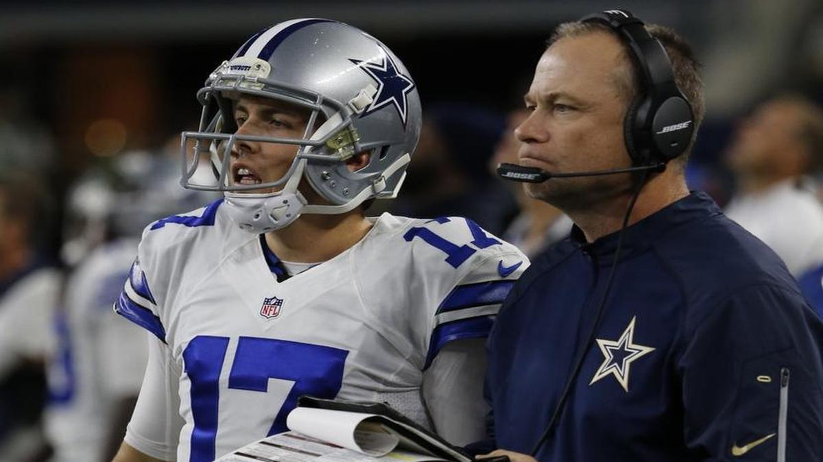 Dallas Cowboys quarterback Kellen Moore stands with offensive coordinator Scott Linehan on the sidelines Saturday against the New York Jets at AT&T Stadium in Arlington, Texas.