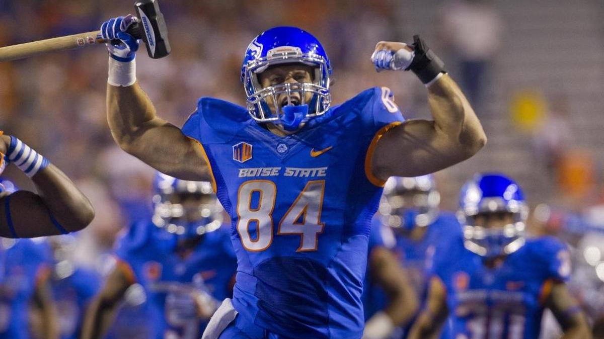 Boise State tight end Jake Knight leads the Broncos onto the blue turf of Albertsons Stadium for the home opener with Washington State on Sept. 10, 2016, in Boise.