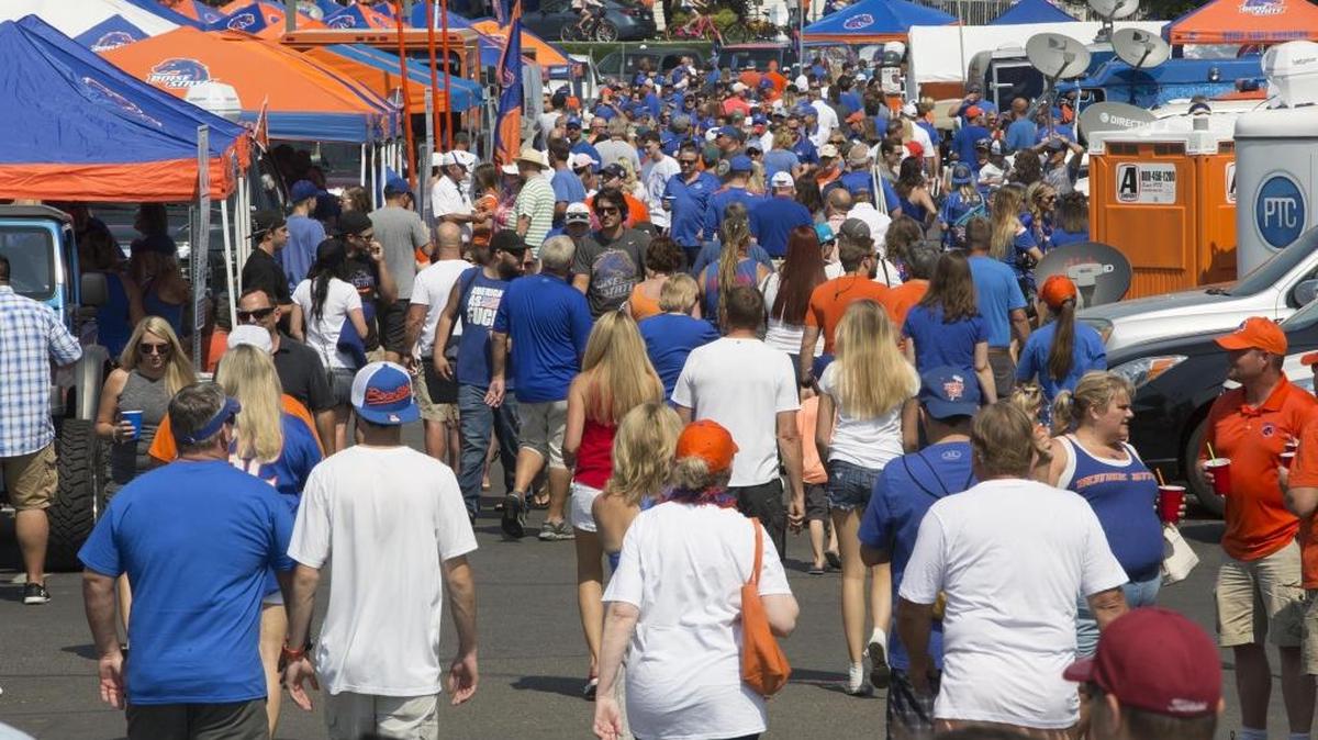 Boise State fans start the annual tailgating tradition of dressing the parking lot in blue and orange at Albertsons Stadium for the home opener vs. Troy.