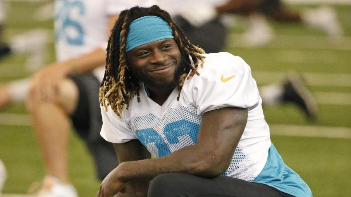Miami Dolphins running back Jay Ajayi stretches out during NFL football organized team activities in May at the Dolphins training facility in Davie, Fla.