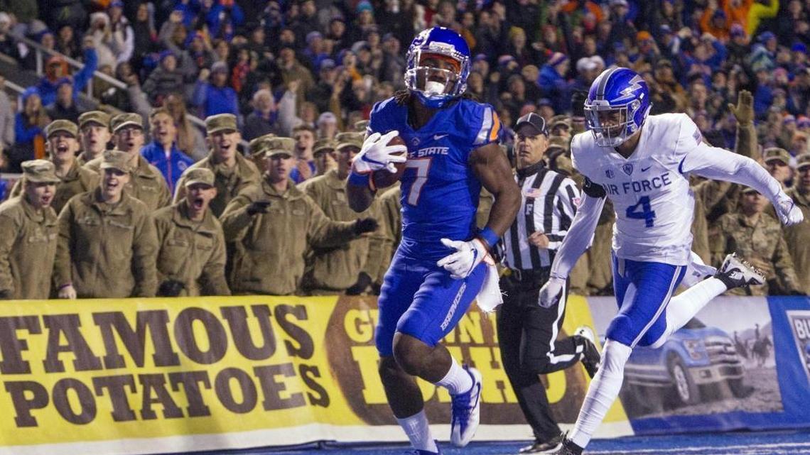 Boise State wide receiver A.J. Richardson scores a touchdown on an 87-yard reception defended by Air Force defensive back James Jones in the first quarter Saturday at Albertsons Stadium in Boise.