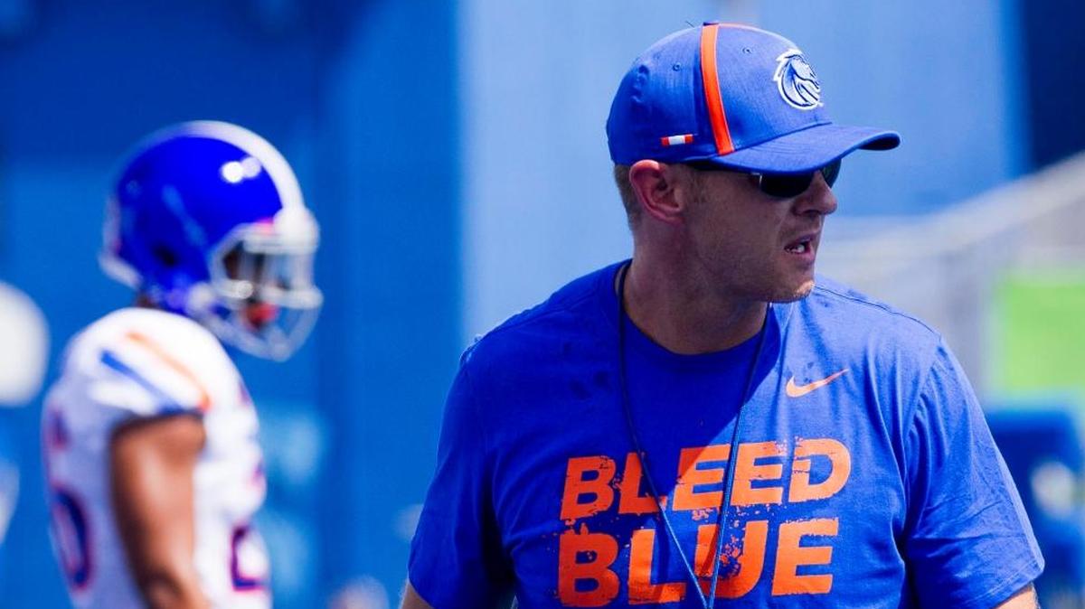 Boise State football coach Bryan Harsin wears the Broncos’ “Bleed Blue” shirt while directing the team scrimmage Aug. 26, 2017 during fall camp at Albertsons Stadium.